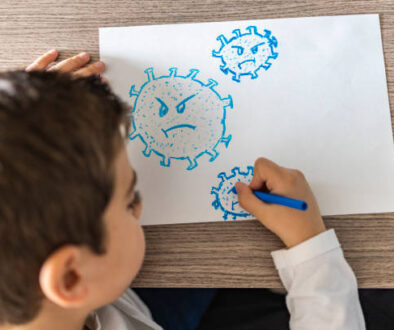 Little kid drawing a coronavirus